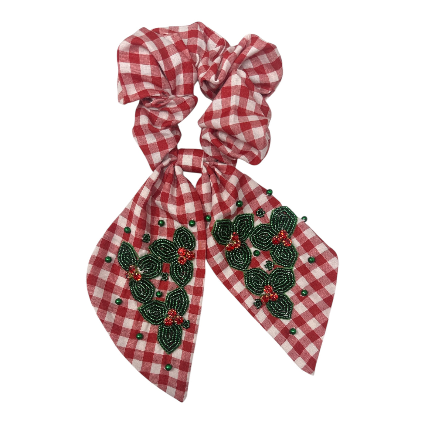 Red gingham scrunchie with bow decorated with beaded green holly leaves and red berries.